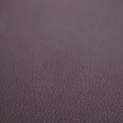 Boston Faux Leather Upholstery Fabric in a deep aubergine purple colour, showcasing a fine pebbled grain texture.