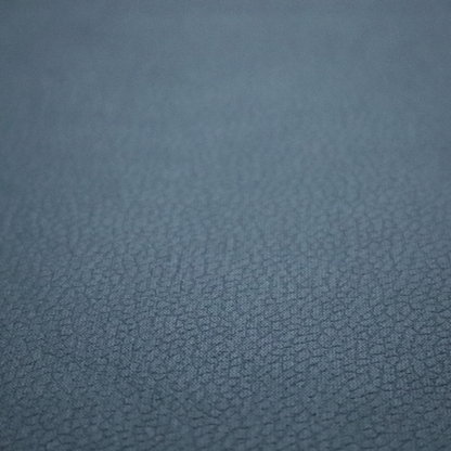 Boston Faux Leather Upholstery Fabric in a slate blue colour, showcasing a fine pebbled grain texture.