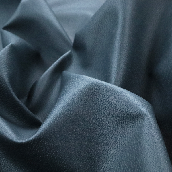 Boston Faux Leather Upholstery Fabric in a slate blue colour, showcasing a fine pebbled grain texture.