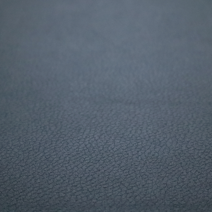 Boston Faux Leather Upholstery Fabric in a deep steel blue colour, highlighting a fine pebbled grain texture.