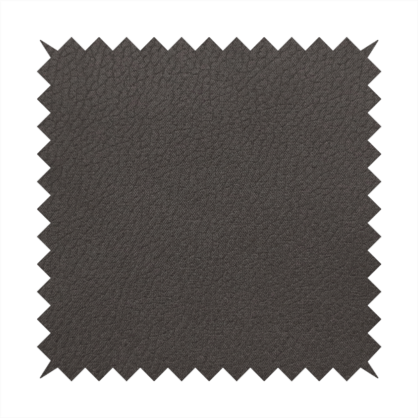 Boston Faux Leather Upholstery Fabric in a deep dark green colour, showcasing a fine pebbled grain texture.
