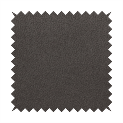 Boston Faux Leather Upholstery Fabric in a deep dark green colour, showcasing a fine pebbled grain texture.