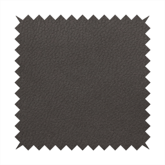 Boston Faux Leather Upholstery Fabric in a deep dark green colour, showcasing a fine pebbled grain texture.