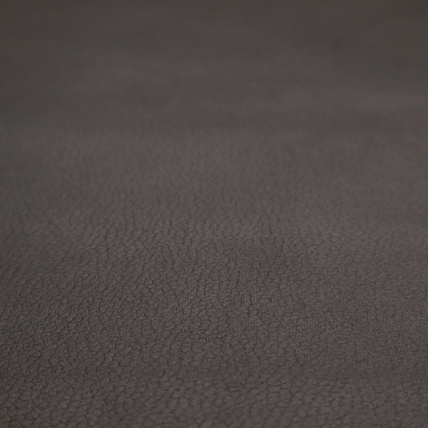 Boston Faux Leather Upholstery Fabric in a deep dark green colour, showcasing a fine pebbled grain texture.