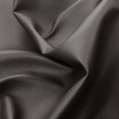 Boston Faux Leather Upholstery Fabric in a deep dark green colour, showcasing a fine pebbled grain texture.