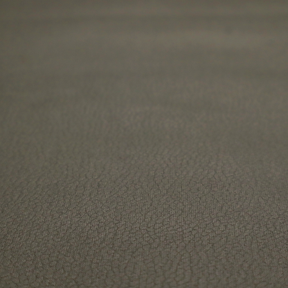 Boston Faux Leather Upholstery Fabric in a deep olive green colour, showcasing a fine pebbled grain texture.