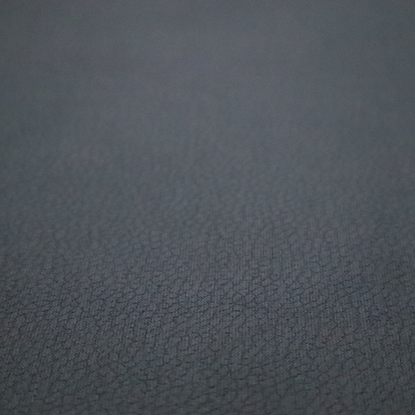 Boston Faux Leather Upholstery Fabric in a deep charcoal grey colour, showcasing a fine pebbled grain texture.