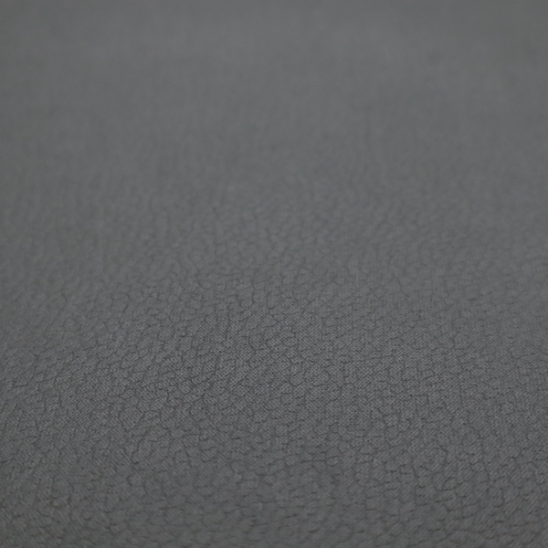 Boston Faux Leather Upholstery Fabric in a mid grey colour, showcasing a fine pebbled grain texture.