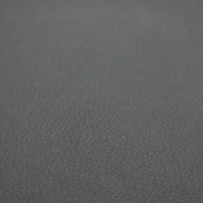Boston Faux Leather Upholstery Fabric in a mid grey colour, showcasing a fine pebbled grain texture.
