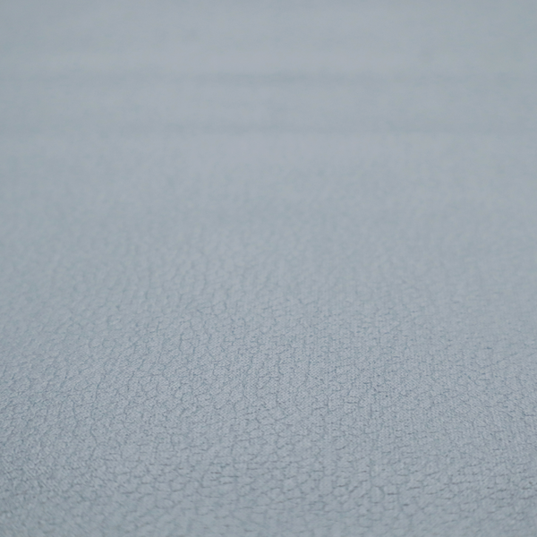 Boston Faux Leather Upholstery Fabric in a light grey colour, showcasing a fine pebbled grain texture.