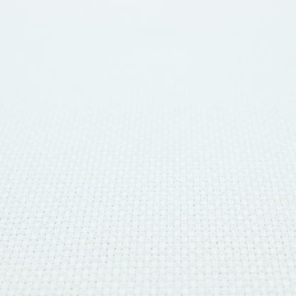 A solid white fabric with a distinct, tightly woven grid texture. The material features a uniform, grid-like pattern of tiny raised squares, reminiscent of Aida cloth or a textured linen blend, creating a subtle, clean, and matte finish across the entire surface.