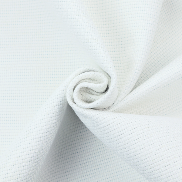 A solid white fabric with a distinct, tightly woven grid texture. The material features a uniform, grid-like pattern of tiny raised squares, reminiscent of Aida cloth or a textured linen blend, creating a subtle, clean, and matte finish across the entire surface.