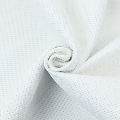A solid white fabric with a distinct, tightly woven grid texture. The material features a uniform, grid-like pattern of tiny raised squares, reminiscent of Aida cloth or a textured linen blend, creating a subtle, clean, and matte finish across the entire surface.