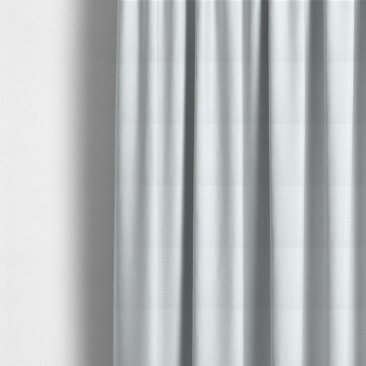The fabric used to create these made-to-measure curtains is a solid white fabric with a distinct, tightly woven grid texture. The material features a uniform, grid-like pattern of tiny raised squares, reminiscent of Aida cloth or a textured linen blend, creating a subtle, clean, and matte finish across the entire surface.