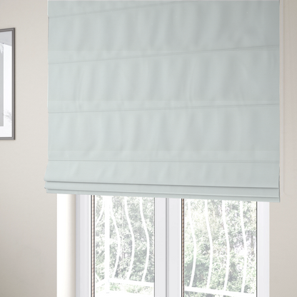 The fabric used to create these Roman blinds is a solid white fabric with a distinct, tightly woven grid texture. The material features a uniform, grid-like pattern of tiny raised squares, reminiscent of Aida cloth or a textured linen blend, creating a subtle, clean, and matte finish across the entire surface.