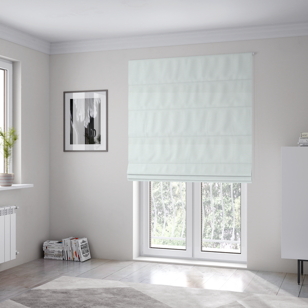 The fabric used to create these Roman blinds is a solid white fabric with a distinct, tightly woven grid texture. The material features a uniform, grid-like pattern of tiny raised squares, reminiscent of Aida cloth or a textured linen blend, creating a subtle, clean, and matte finish across the entire surface.