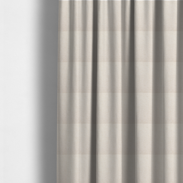 The fabric used to create these made-to-measure curtains is a cream or off-white fabric featuring a distinct, tightly woven grid texture. The material has a uniform, basket-weave style pattern with subtle variations in tone, creating a soft, warm, and matte finish across the entire surface.