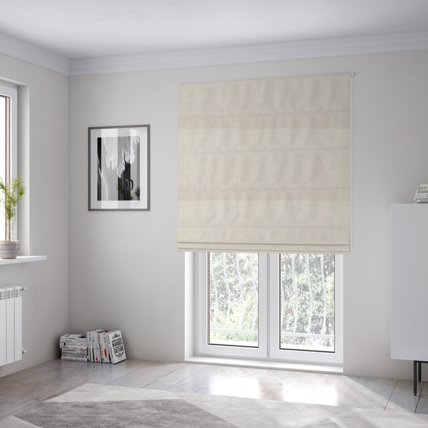 The fabric used to create these Roman blinds is a cream or off-white fabric featuring a distinct, tightly woven grid texture. The material has a uniform, basket-weave style pattern with subtle variations in tone, creating a soft, warm, and matte finish across the entire surface.