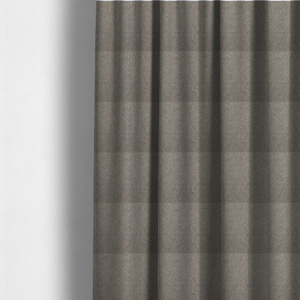 The fabric used to create these made-to-measure curtains is a taupe or light greyish-brown fabric featuring a distinct, tightly woven grid texture. The material showcases a multi-tonal, basket-weave style pattern with blending neutral threads, creating a soft, heathered, and matte finish across the entire surface.
