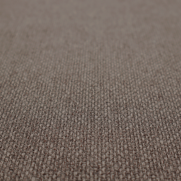 A medium brown or mocha fabric featuring a distinct, tightly woven grid texture. The material showcases a multi-tonal, basket-weave style pattern with interlaced neutral and earthy threads, creating a rich, textured, and matte finish across the entire surface.