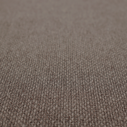 A medium brown or mocha fabric featuring a distinct, tightly woven grid texture. The material showcases a multi-tonal, basket-weave style pattern with interlaced neutral and earthy threads, creating a rich, textured, and matte finish across the entire surface.