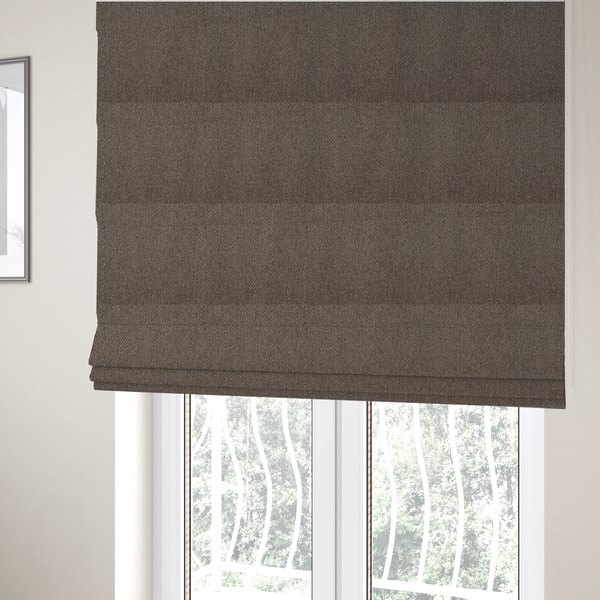 The fabric used to create these Roman blinds is a medium brown or mocha fabric featuring a distinct, tightly woven grid texture. The material showcases a multi-tonal, basket-weave style pattern with interlaced neutral and earthy threads, creating a rich, textured, and matte finish across the entire surface.