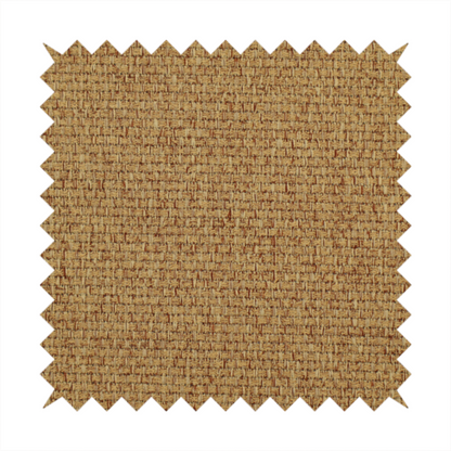 A golden brown or mustard fabric featuring a distinct, tightly woven grid texture. The material showcases a multi-tonal, basket-weave style pattern with blended ochre and tan threads, creating a warm, vibrant, and matte finish across the entire surface.