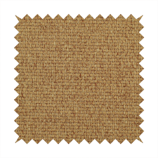 A golden brown or mustard fabric featuring a distinct, tightly woven grid texture. The material showcases a multi-tonal, basket-weave style pattern with blended ochre and tan threads, creating a warm, vibrant, and matte finish across the entire surface.