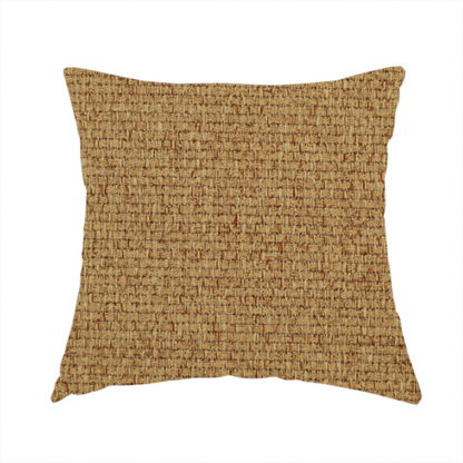 The fabric used to create this handmade cushion is a golden brown or mustard fabric featuring a distinct, tightly woven grid texture. The material showcases a multi-tonal, basket-weave style pattern with blended ochre and tan threads, creating a warm, vibrant, and matte finish across the entire surface.
