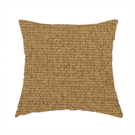 The fabric used to create this handmade cushion is a golden brown or mustard fabric featuring a distinct, tightly woven grid texture. The material showcases a multi-tonal, basket-weave style pattern with blended ochre and tan threads, creating a warm, vibrant, and matte finish across the entire surface.
