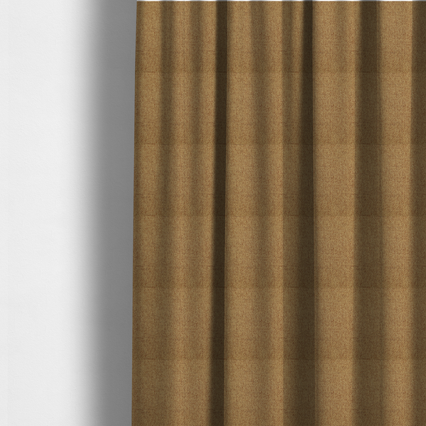 The fabric used to create these made-to-measure curtains is a golden brown or mustard fabric featuring a distinct, tightly woven grid texture. The material showcases a multi-tonal, basket-weave style pattern with blended ochre and tan threads, creating a warm, vibrant, and matte finish across the entire surface.