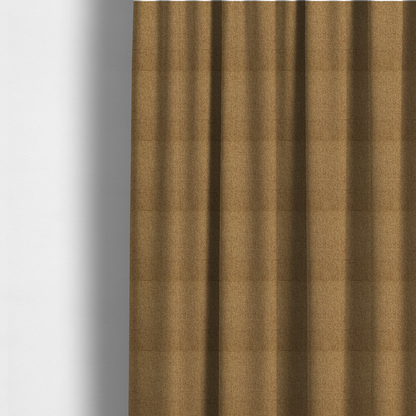 The fabric used to create these made-to-measure curtains is a golden brown or mustard fabric featuring a distinct, tightly woven grid texture. The material showcases a multi-tonal, basket-weave style pattern with blended ochre and tan threads, creating a warm, vibrant, and matte finish across the entire surface.