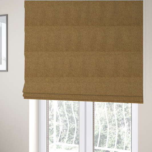 The fabric used to create these Roman blinds is a golden brown or mustard fabric featuring a distinct, tightly woven grid texture. The material showcases a multi-tonal, basket-weave style pattern with blended ochre and tan threads, creating a warm, vibrant, and matte finish across the entire surface.