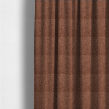 The fabric used to create these made-to-measure curtains is a rust or terracotta-brown fabric featuring a distinct, tightly woven grid texture. The material showcases a multi-tonal, basket-weave style pattern with interlaced copper and warm brown threads, creating a rich, earthy, and matte finish across the entire surface.