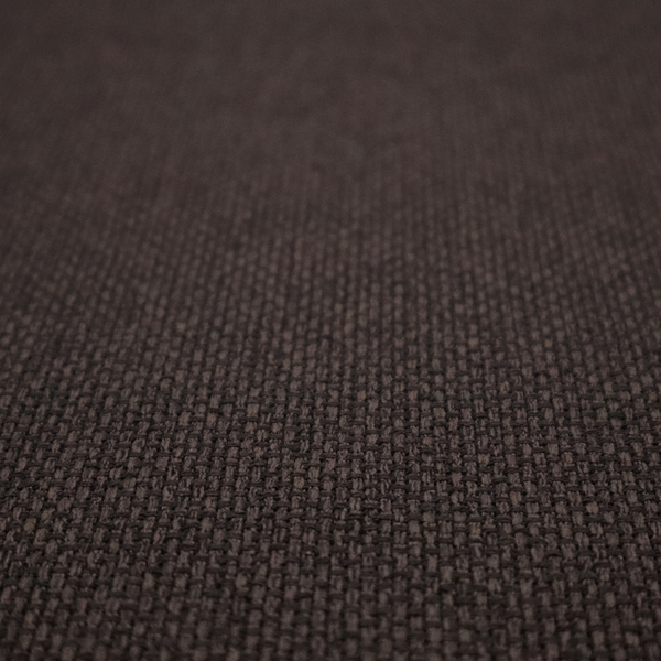 A dark chocolate or espresso brown fabric featuring a distinct, tightly woven grid texture. The material showcases a deep, multi-tonal, basket-weave style pattern with interlaced charcoal and dark brown threads, creating a rich, moody, and matte finish across the entire surface.