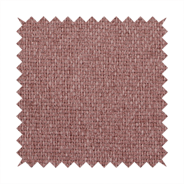 A dusty rose or mauve fabric featuring a distinct, tightly woven grid texture. The material showcases a multi-tonal, basket-weave style pattern with blended pinkish-brown and muted rose threads, creating a soft, sophisticated, and matte finish across the entire surface.