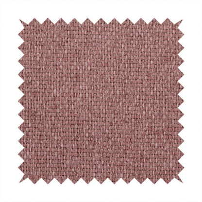 A dusty rose or mauve fabric featuring a distinct, tightly woven grid texture. The material showcases a multi-tonal, basket-weave style pattern with blended pinkish-brown and muted rose threads, creating a soft, sophisticated, and matte finish across the entire surface.