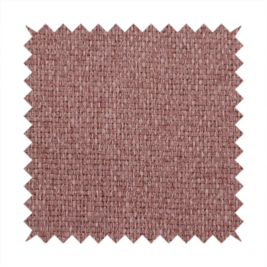 A dusty rose or mauve fabric featuring a distinct, tightly woven grid texture. The material showcases a multi-tonal, basket-weave style pattern with blended pinkish-brown and muted rose threads, creating a soft, sophisticated, and matte finish across the entire surface.
