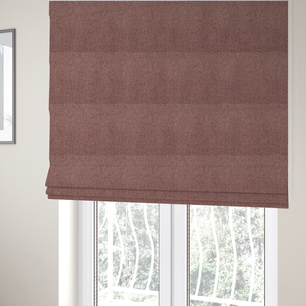 The fabric used to create these Roman blinds is a dusty rose or mauve fabric featuring a distinct, tightly woven grid texture. The material showcases a multi-tonal, basket-weave style pattern with blended pinkish-brown and muted rose threads, creating a soft, sophisticated, and matte finish across the entire surface.