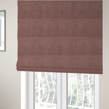 The fabric used to create these Roman blinds is a dusty rose or mauve fabric featuring a distinct, tightly woven grid texture. The material showcases a multi-tonal, basket-weave style pattern with blended pinkish-brown and muted rose threads, creating a soft, sophisticated, and matte finish across the entire surface.
