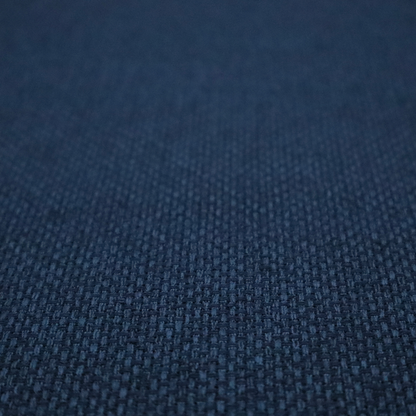 A deep navy or indigo blue fabric featuring a distinct, tightly woven grid texture. The material showcases a multi-tonal, basket-weave style pattern with blended dark blue and subtle charcoal threads, creating a rich, classic, and matte finish across the entire surface.