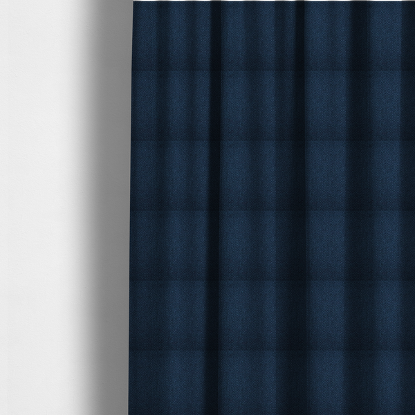 The fabric used to create these made-to-measure curtains is a deep navy or indigo blue fabric featuring a distinct, tightly woven grid texture. The material showcases a multi-tonal, basket-weave style pattern with blended dark blue and subtle charcoal threads, creating a rich, classic, and matte finish across the entire surface.
