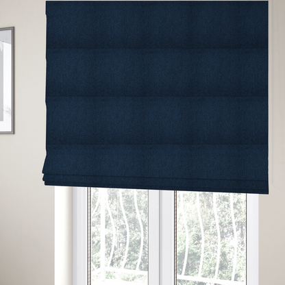 The fabric used to create these Roman blinds is a deep navy or indigo blue fabric featuring a distinct, tightly woven grid texture. The material showcases a multi-tonal, basket-weave style pattern with blended dark blue and subtle charcoal threads, creating a rich, classic, and matte finish across the entire surface.