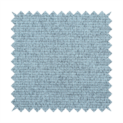 A light ice blue or pastel blue fabric featuring a distinct, tightly woven grid texture. The material showcases a multi-tonal, basket-weave style pattern with blended sky blue and subtle grey threads, creating a fresh, serene, and matte finish across the entire surface.