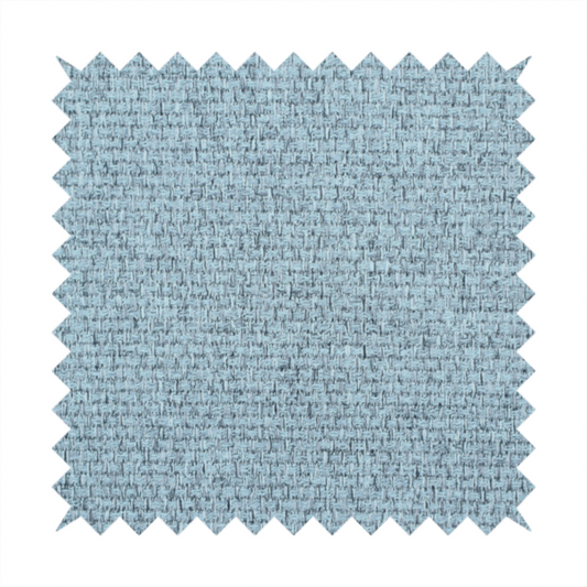 A light ice blue or pastel blue fabric featuring a distinct, tightly woven grid texture. The material showcases a multi-tonal, basket-weave style pattern with blended sky blue and subtle grey threads, creating a fresh, serene, and matte finish across the entire surface.