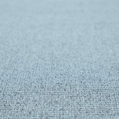 A light ice blue or pastel blue fabric featuring a distinct, tightly woven grid texture. The material showcases a multi-tonal, basket-weave style pattern with blended sky blue and subtle grey threads, creating a fresh, serene, and matte finish across the entire surface.