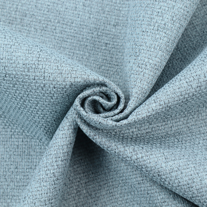 A light ice blue or pastel blue fabric featuring a distinct, tightly woven grid texture. The material showcases a multi-tonal, basket-weave style pattern with blended sky blue and subtle grey threads, creating a fresh, serene, and matte finish across the entire surface.