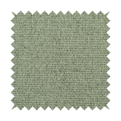 A light sage or mint green fabric featuring a distinct, tightly woven grid texture. The material showcases a multi-tonal, basket-weave style pattern with blended pale green and subtle grey threads, creating a fresh, calming, and matte finish across the entire surface.
