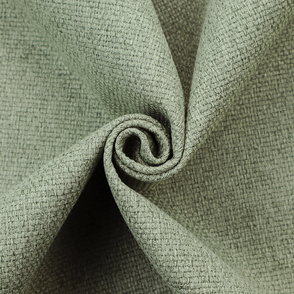 A light sage or mint green fabric featuring a distinct, tightly woven grid texture. The material showcases a multi-tonal, basket-weave style pattern with blended pale green and subtle grey threads, creating a fresh, calming, and matte finish across the entire surface.