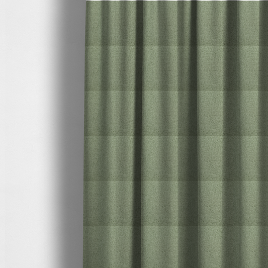 The fabric used to create these made-to-measure curtains is a light sage or mint green fabric featuring a distinct, tightly woven grid texture. The material showcases a multi-tonal, basket-weave style pattern with blended pale green and subtle grey threads, creating a fresh, calming, and matte finish across the entire surface.